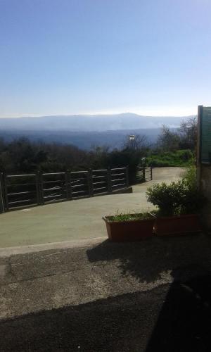 a view from the top of a hill with a fence at Locanda Amato in Amato