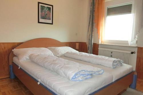 Appartement KMB Gerlitzen Ossiachersee Kärnten mit Hallenbadにあるベッド
