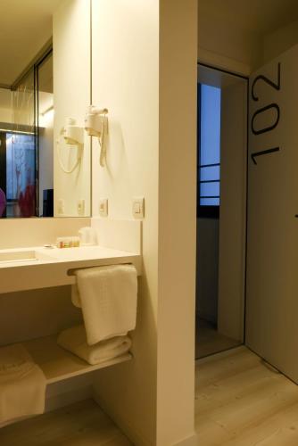 a bathroom with a sink and a mirror at Corbie Lommel Ring in Lommel