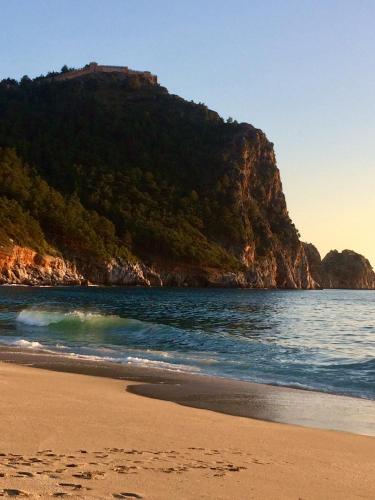 a view of a beach with a mountain in the background at Anastasia Apartments in Kargicak