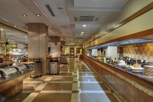 a large restaurant with a long buffet line at Sunis Kumköy Beach Resort Hotel & Spa in Side