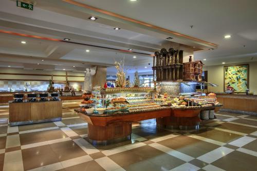a store with a buffet of food in a mall at Sunis Kumköy Beach Resort Hotel & Spa in Side