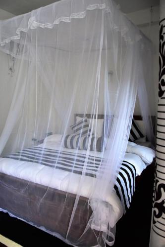 Ένα ή περισσότερα κρεβάτια σε δωμάτιο στο River Splendour Home Stay