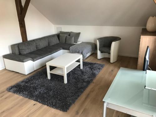 a living room with a couch and a table at Hotel Ristorante Milano in Bad Tölz