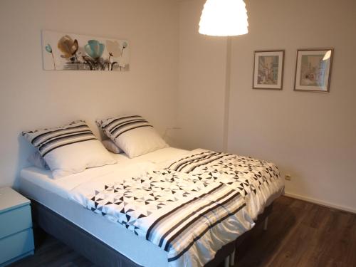 Кровать или кровати в номере Appartment Grau im Grünen