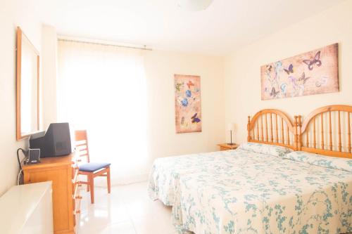 Postel nebo postele na pokoji v ubytování Santa Eulalia IBERPLAYA
