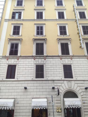 a tall building with many windows on it at Hotel Stromboli in Rome