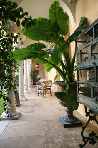 a hallway with a bunch of plants in a building at Jardins Secrets in Nîmes