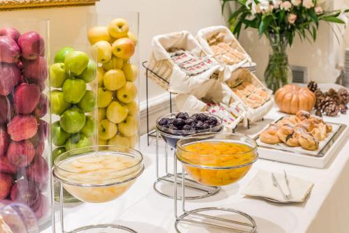 a buffet filled with different types of fruits and vegetables at Raeli Hotel Noto in Rome