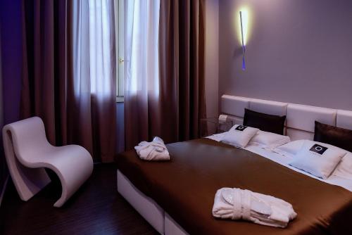 Postel nebo postele na pokoji v ubytování Le Camp Suite & Spa