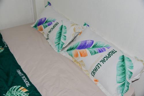 a group of pillows with feathers on them at Bảo Lộc Homestay in Bao Loc