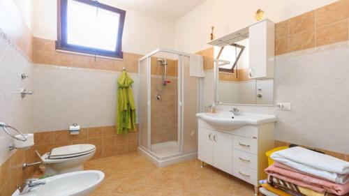 Vonios kambarys apgyvendinimo įstaigoje Appartamenti Fior Di Loto