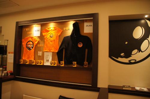 a display case in a store with a bunch of shirts at Moon Hostel Bio in Bilbao