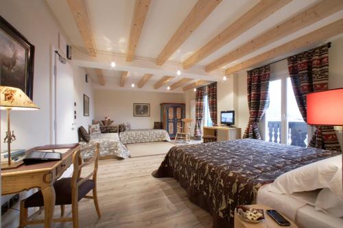 Postel nebo postele na pokoji v ubytování Hotel Savoia dal 1924