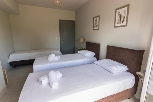 Cama o camas de una habitación en Amera - Troumpas Family Apartments