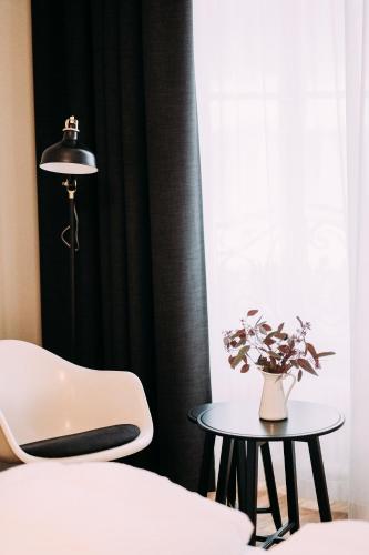 Postel nebo postele na pokoji v ubytování ADLER Boutique Hotel
