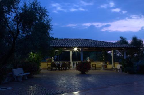 a patio with a gazebo with a table and chairs at Villa Del Colle in Monte San Giovanni Campano