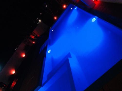 a blue stage with lights on it at night at Villa Kandy in Kandy