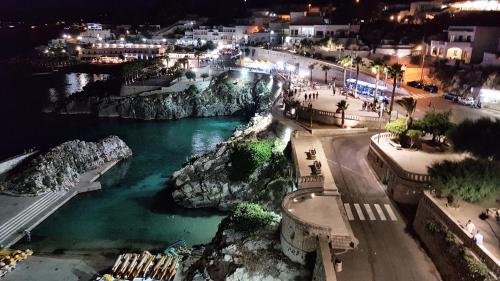a view of a river at night with a city at Oikia Vacanze Diso Giulia in Diso