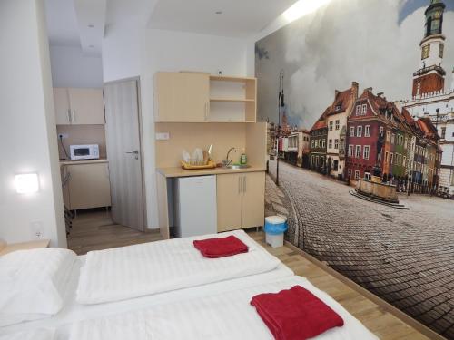 a bedroom with a wall mural of a city at Kálvin Vendégszobák in Debrecen