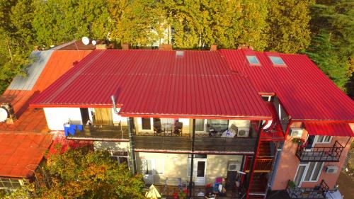 an overhead view of a house with a red roof at Hotel Your Comfort in Tbilisi City