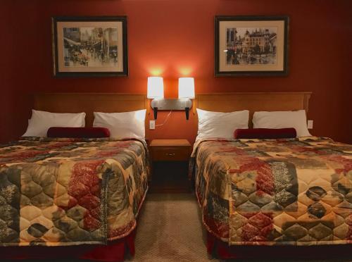 Ένα ή περισσότερα κρεβάτια σε δωμάτιο στο Sahara Suites