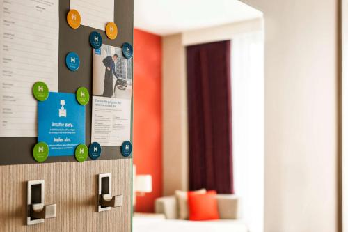 a wall with a bunch of stickers on it at Hyatt House Gebze in Gebze