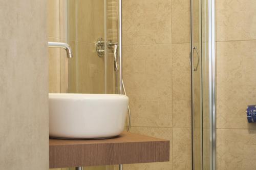 a bathroom with a sink and a shower at VILLA FENIX OSIO SOTTO in Osio Sotto