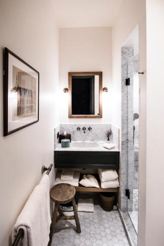 a bathroom with a sink and a bath tub at 1898 The Post in Ghent