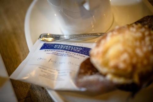 a plate of food with a bagel on a table at Eco Rooms&Breakfast Tirano in Tirano