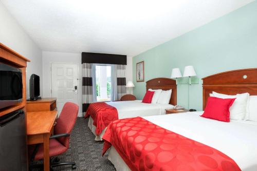 Una cama o camas en una habitación de Ramada by Wyndham Pelham