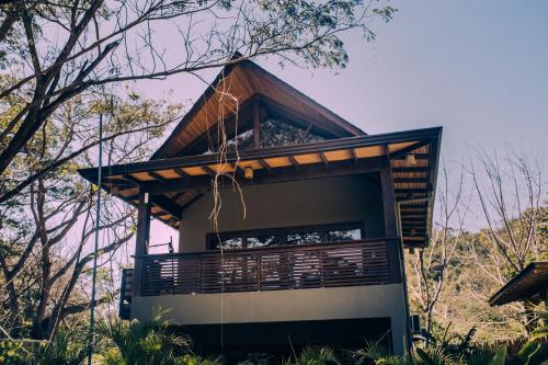 a modern house with a gambrel roof at Lua Villas in Santa Teresa Beach