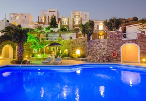 a large swimming pool in front of a building at Hotel Katerina in Mylopotas