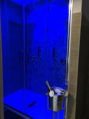 a bathroom with a shower with a trash can at Alba Camere in Palermo