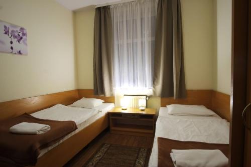 Postel nebo postele na pokoji v ubytování Hotel Miramar