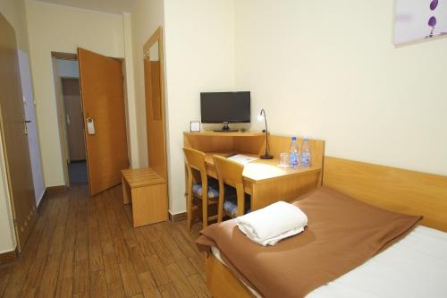 Postel nebo postele na pokoji v ubytování Hotel Miramar
