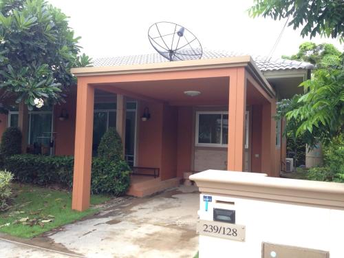 a house with an orange cover on the front of it at Casa Seaside Rayong by Chate in Rayong