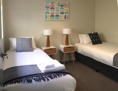 Katil atau katil-katil dalam bilik di Kangaroo Bay Apartments