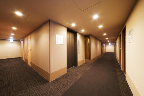 a row of walkways in an office building at Super Hotel JR Nara Ekimae Sanjo Dori in Nara