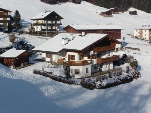 an aerial view of a house in the snow at Landhaus Maria in Finkenberg