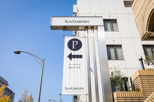 a sign for the san francisco samsung garden at Hotel Sun Garden Matsuyama in Matsuyama