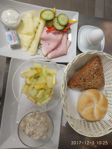 a tray with different types of food on it at Hotel Restaurant Sailer in Seewalchen