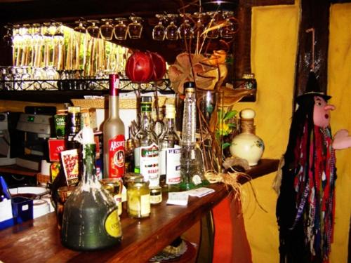 a bar with bottles of alcohol on a table at Pousada Bambu Brasil in Sao Jorge