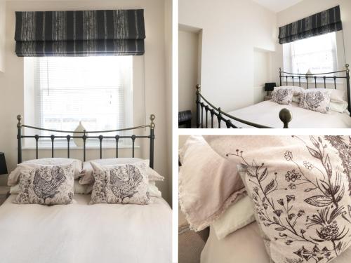 una camera da letto con letto, cuscini e finestra di Wye View a Ross on Wye