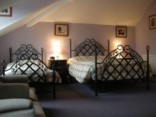 Кровать или кровати в номере Buckingham Hotel