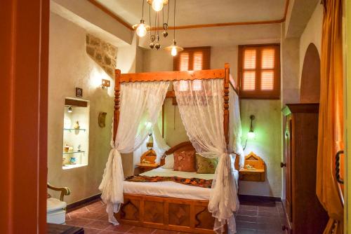 Кровать или кровати в номере Elafusa Luxury Apartment