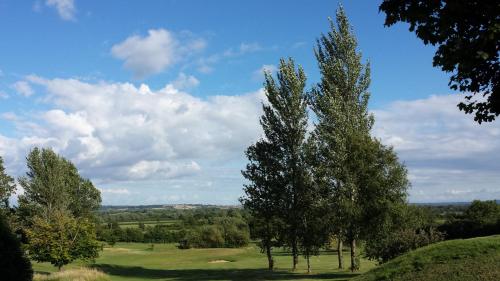 a group of trees on a golf course at Cricklade House Hotel, Sure Hotel Collection by Best Western in Cricklade