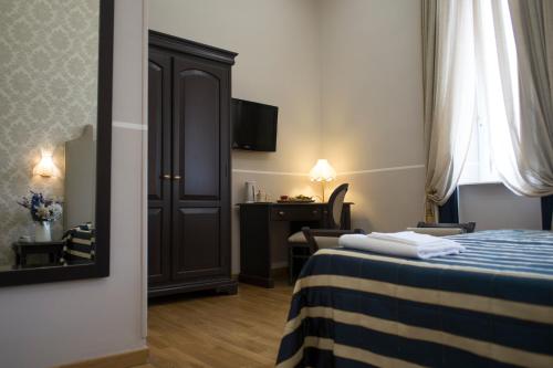 Ένα ή περισσότερα κρεβάτια σε δωμάτιο στο Hotel Navy