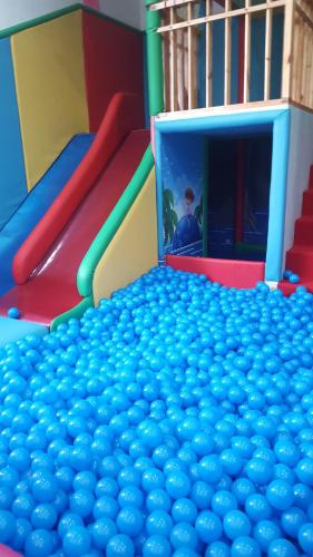 a large pile of balls in a play room at MJ's Residences Garden Hotel in Moalboal