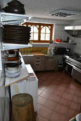 a kitchen with a bunch of dishes on a counter at Durda in Poronin